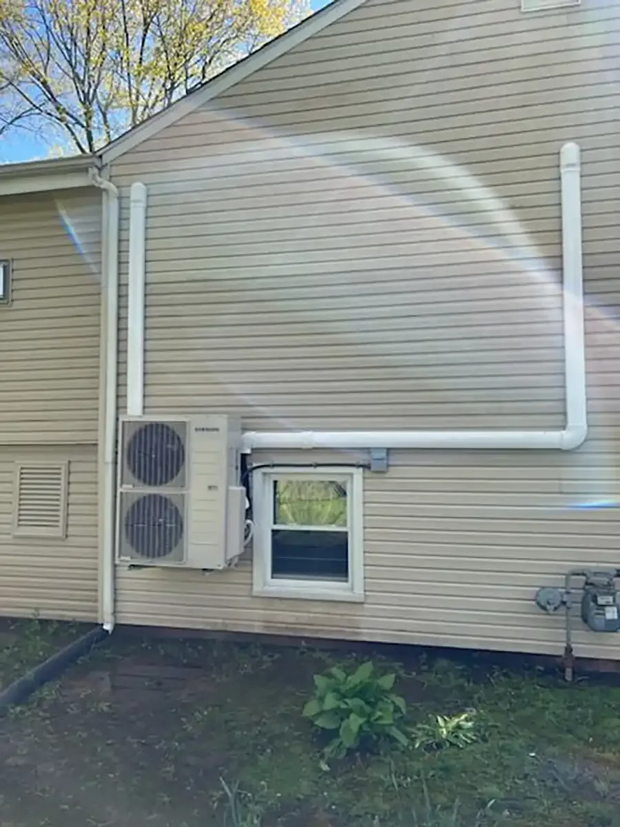 Dual mini-split system installation on home exterior